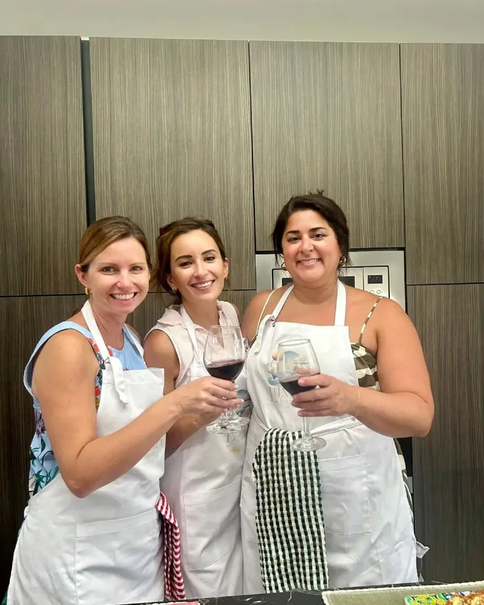 Guests raising a glass during a private Sicilian cooking class